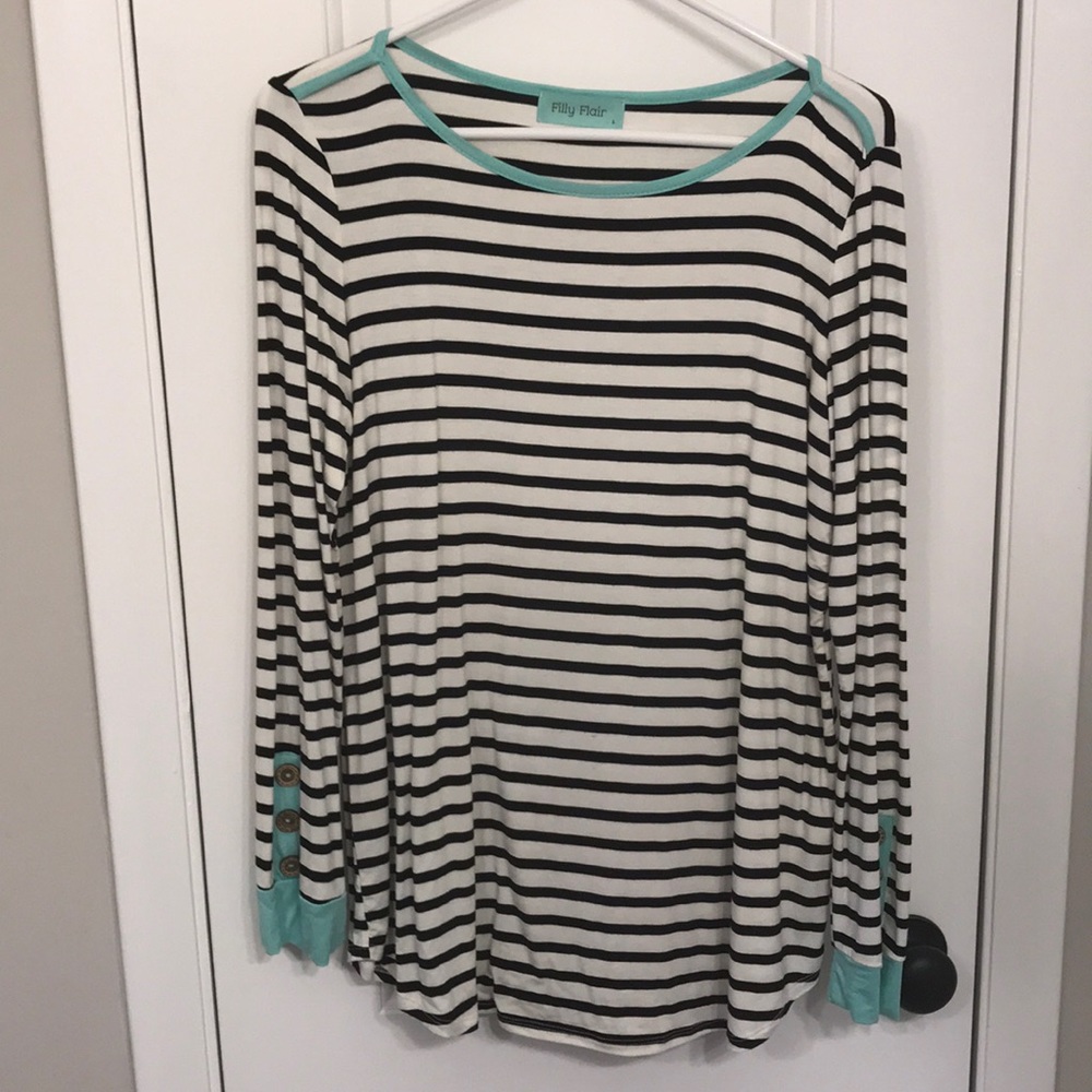 Striped top with turquoise and button cuffs.